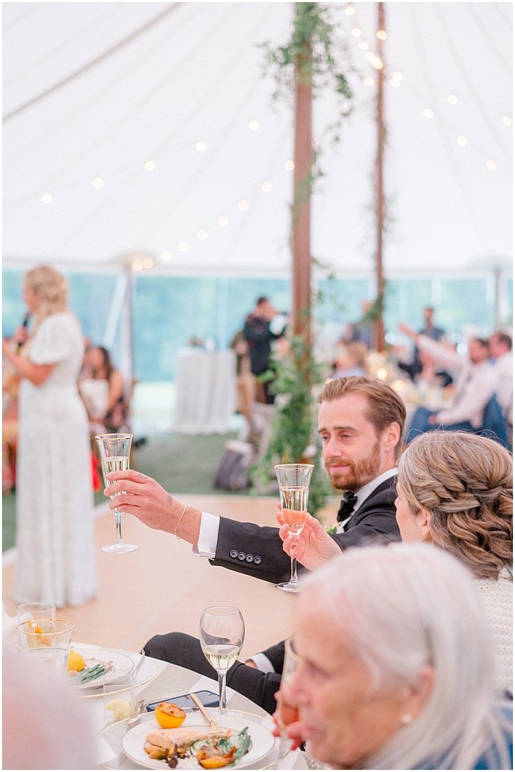 tented wedding champagne toast