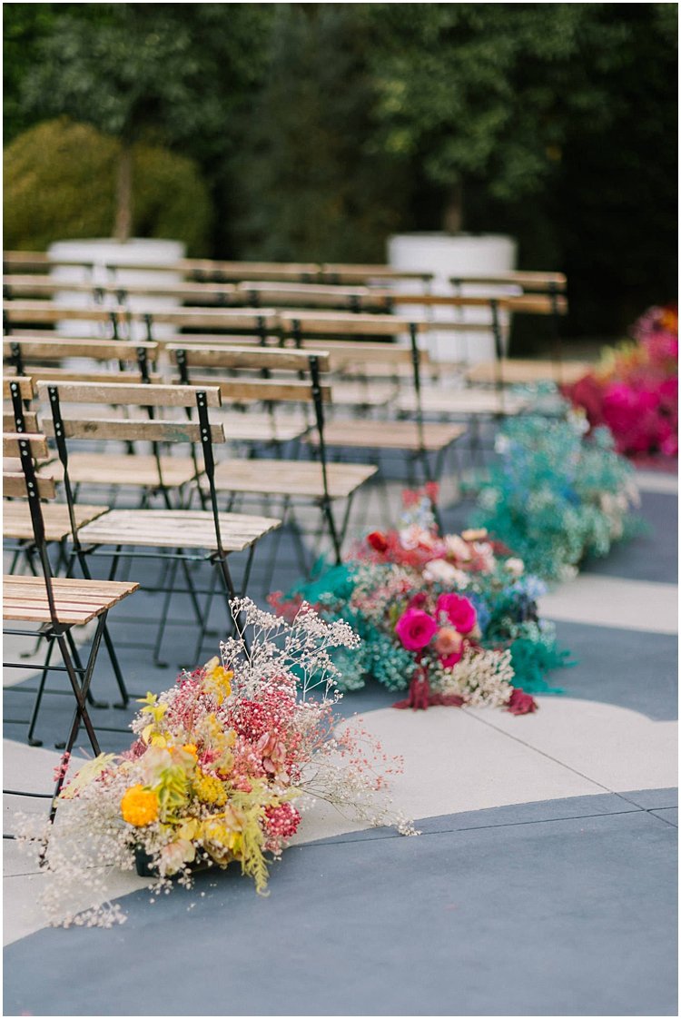 colorful boho wedding ceremony flowers