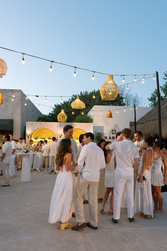 chable maroma white party guests talking
