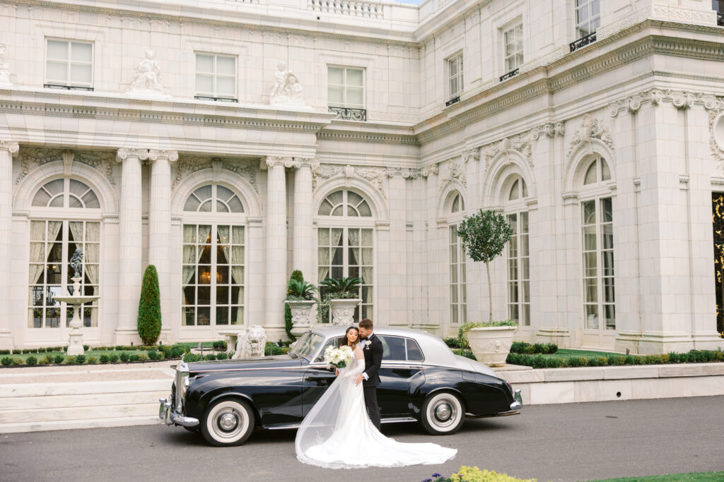 newport mansion wedding couple with car