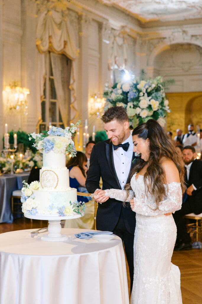 wedding cake cutting with bride and groom